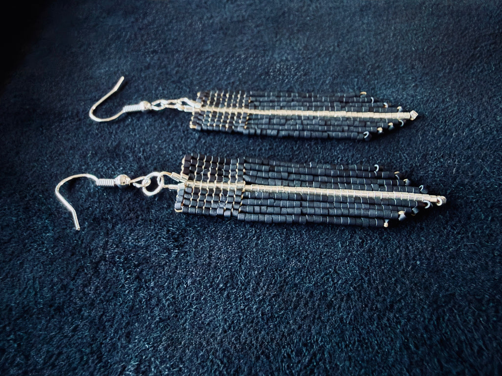 Matte Black & Silver Beaded fringe earrings on a black background