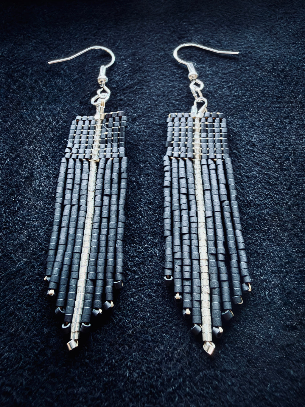 Matte Black & Silver Beaded fringe earrings on a black background
