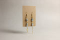 Aquamarine Dangle Earrings with Gold Spirals on a brown display card